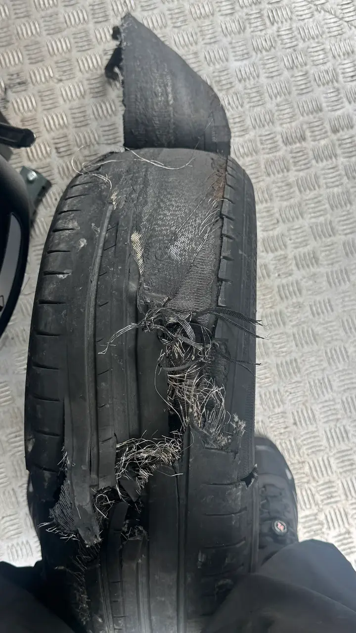 A tyre shredded by being driven on flat, which is why you should not limp to a garage