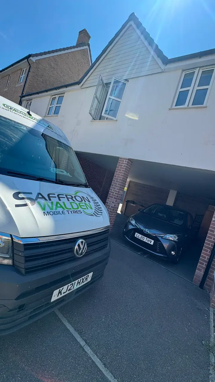 The van on a customer driveway, fitting tyres at home